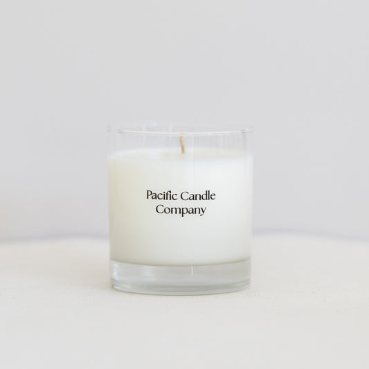 A single wick soy candle in a sleek glass jar, hand-poured with toxin-free wax and a cotton braided wick for a clean, even burn. Perfect for adding a warm glow and a subtle fragrance to any room. 